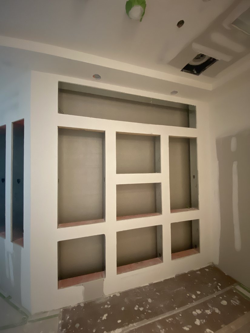 Drywall built-in with recessed panels finished and ready for paint