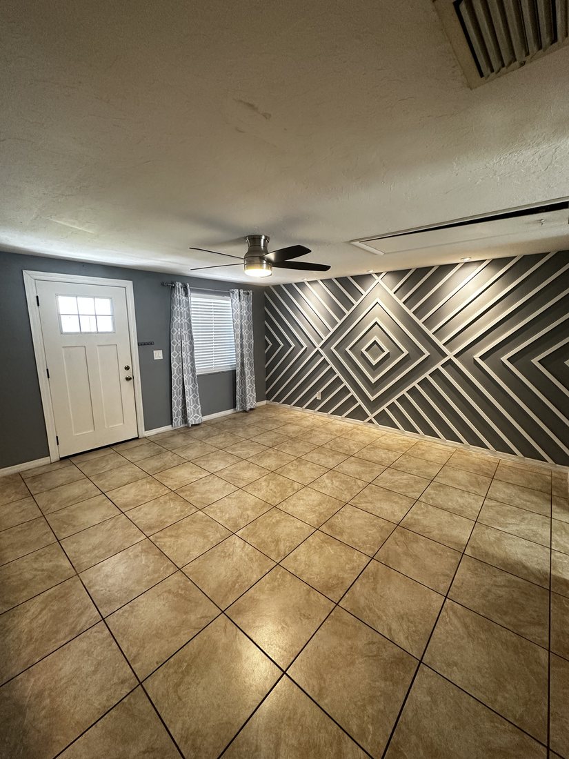 Chevron panelled accent wall across an open living room