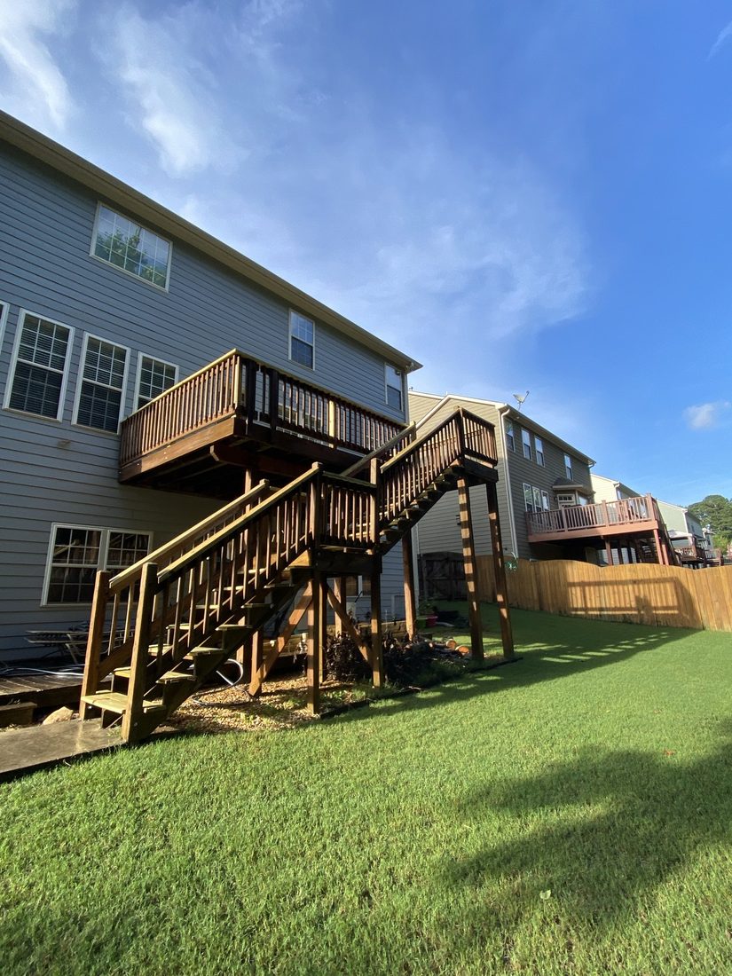 Elevated deck with stairs on a two-story home