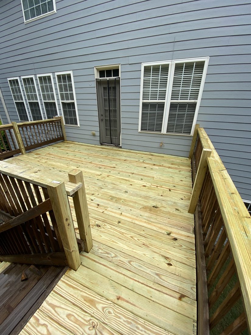 Wraparound pressure-treated deck with railing