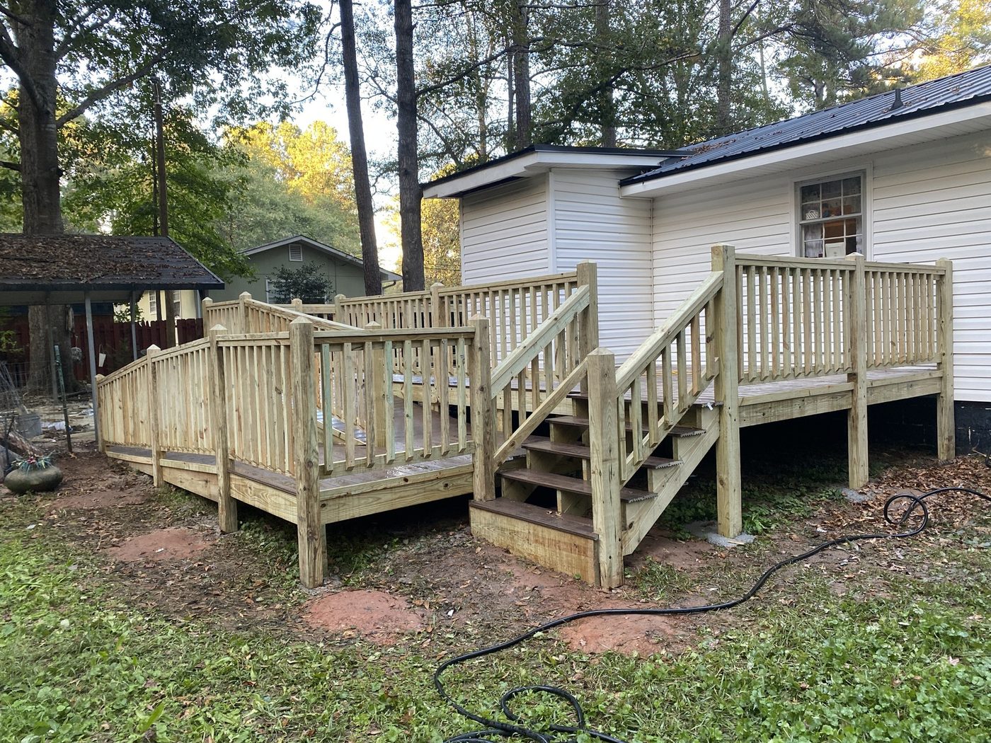 Deck with railing and stairs down to the yard
