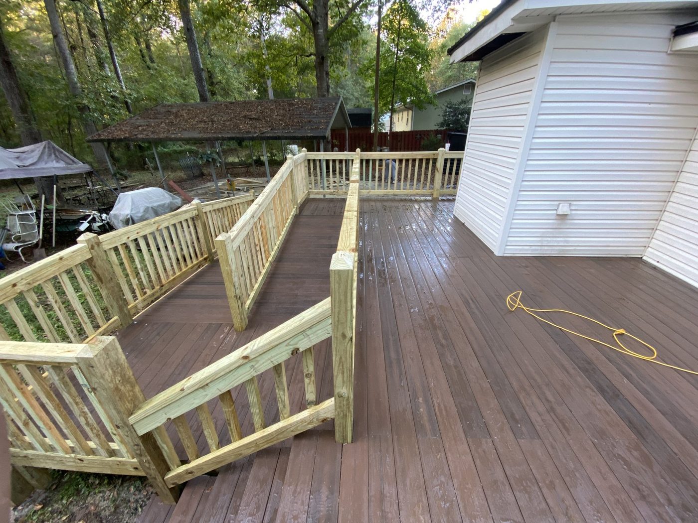 Stained deck with bench seating and railing