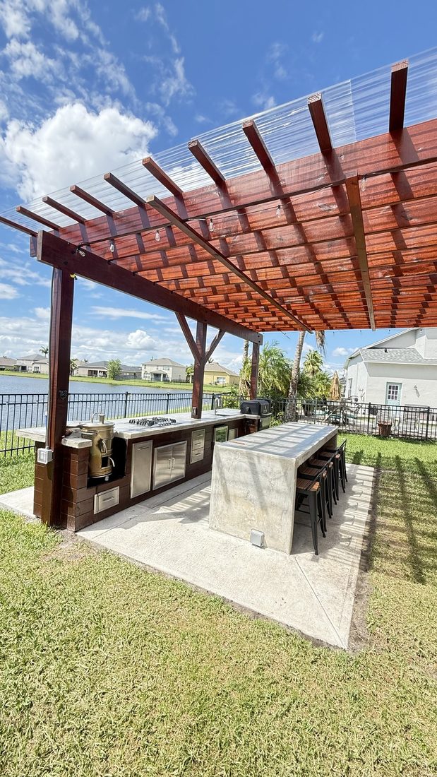 Pergola with an outdoor bar and integrated lighting on the water